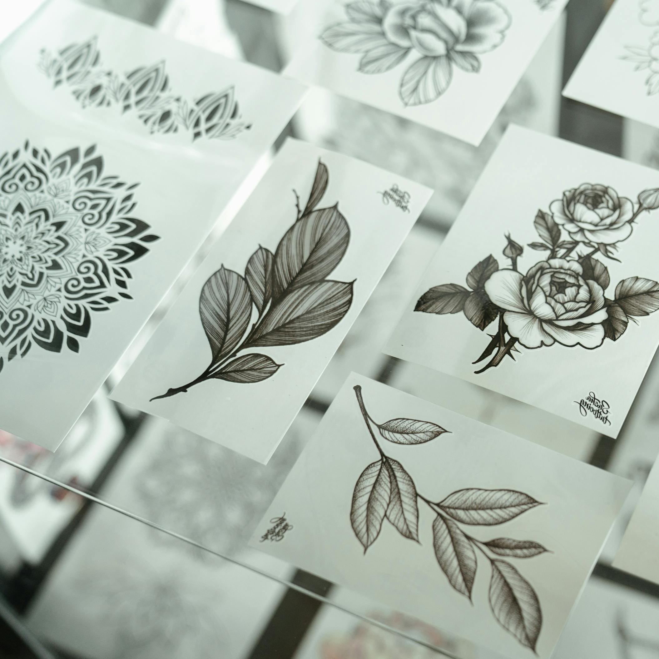 image of a person leaning on a desk next to a briefcase surrounded by money.