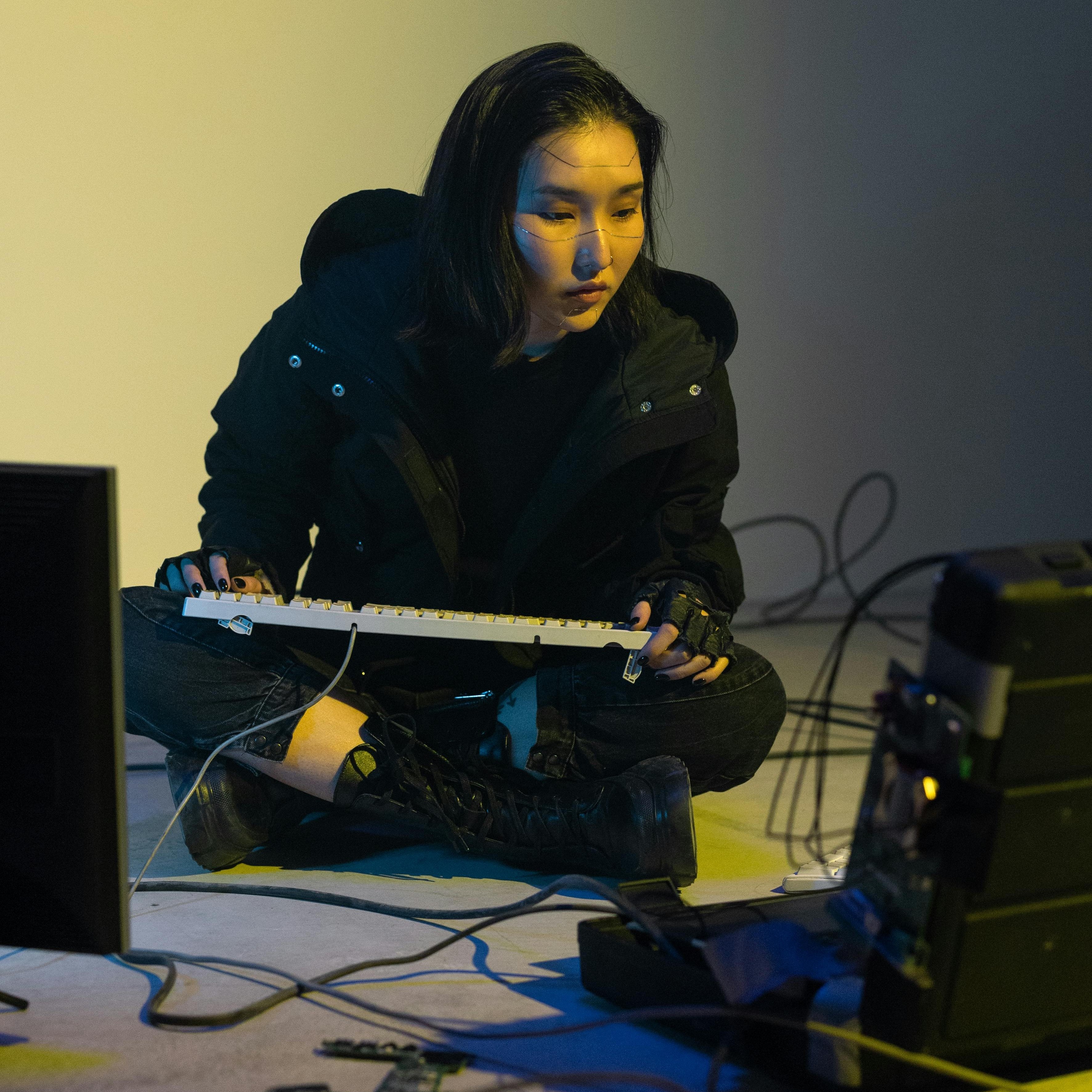 image of a person leaning on a desk next to a briefcase surrounded by money.